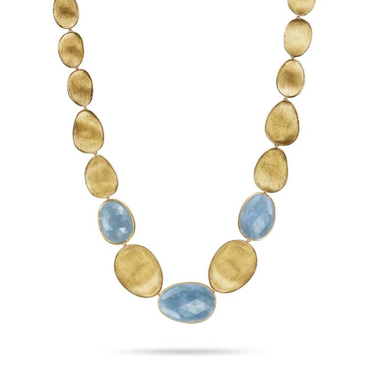 Marco Bicego necklace in yellow gold from the Lunaria high jewellery collection, set with dark aquamarines and engraved with the iconic Mulino finish.